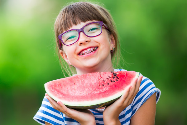 girl-with-watermelon-and-braces
